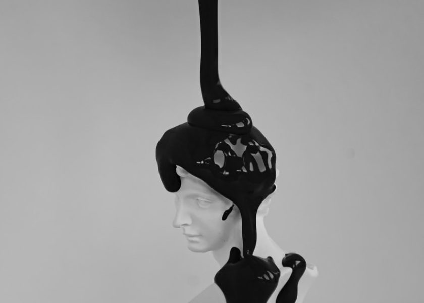woman in black dress figurine